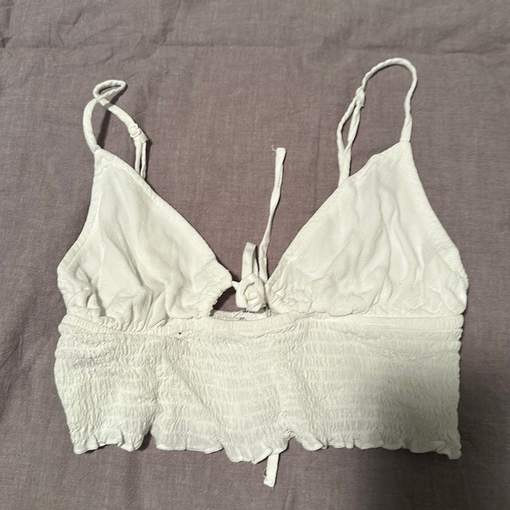 A cute white crop top from garage! It is size medium and super stretchy ! - Picture 1 of 2